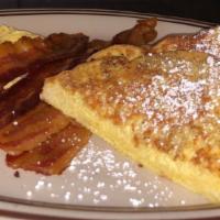 New England Breakfast · Pancakes or french toast, two farm fresh eggs (your style), four bacon strips, four sausage ...