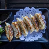 Gyoza · Pan fried / steamed pork or vegetable dumpling.