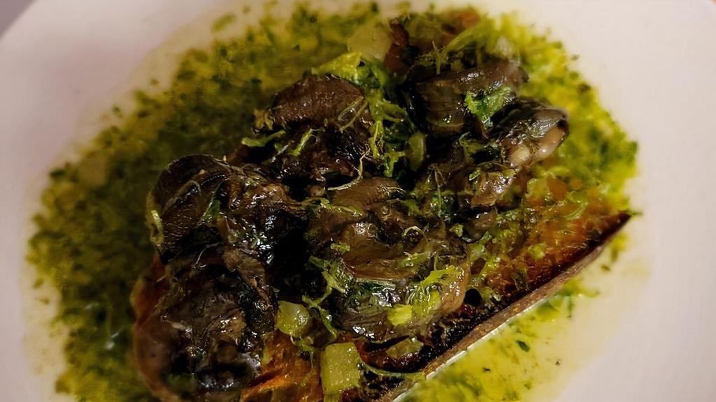 Escargot Toast · Herbed garlic butter over country bread