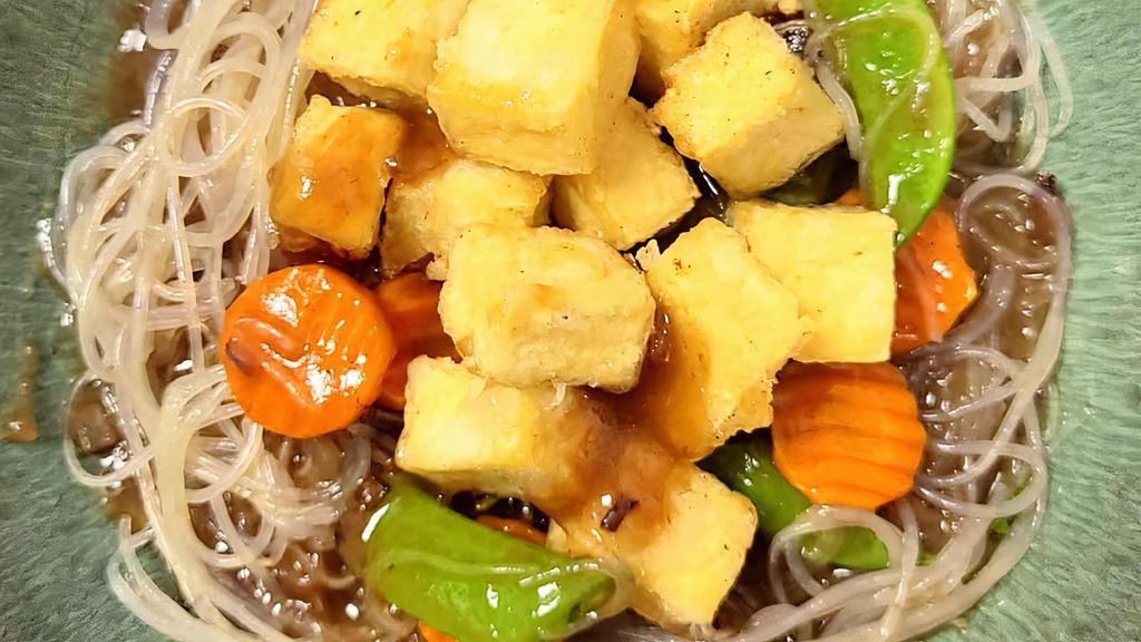 Pan-Seared Tofu · Crispy tofu stir fry with carrots and sugar snap peas.  Served with your choice of white rice or glass noodles.