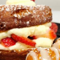 Strawberry Shortcake Stuffed Donut · Filled with fresh strawberries and homemade vanilla whipped cream.  Topped with powdered sug...