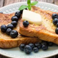 Blueberry French Toast · Sliced fresh bread soaked in eggs and milk, then fried topped with fresh blueberries served ...