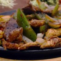 Fajitas · All our fajitas are grilled with bell peppers, onions and tomatoes. Served with rice, beans,...