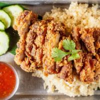Crispy Chicken Rice · Ginger rice with fried chicken serve with daikon soup and sweet chili sauce.