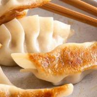 Gyoza (Dumplings) · Steam or Fried. Chicken Dumpling served with ginger sauce.