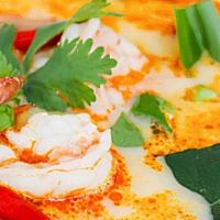 Tom Yum Soup · The famous Thai hot and spicy soup is spiced with lemon grass lime juice and chili top with ...