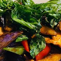 Eggplant Basil · Stir-fried eggplant, bell peppers in basil sauce, topped with fresh basil.