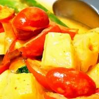 Mango Curry · Slice of fresh sweet mango, carrots, onions, red & green pepper in yellow curry.