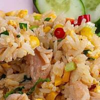 Thai Fried Rice · Fried rice with eggs, green peas, carrot, tomatoes, topped with scallions.