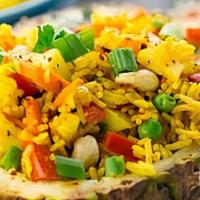 Pineapple Fried Rice · Fried rice with eggs, peas, carrots and pineapples touch of curry powders.