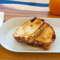 Sweet Butter Bacon Grilled Cheese · Buttered, toasted sourdough bread, melted brie, cheddar & pepper jack cheese, thick cut appl...