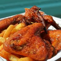 Banga Wings · Traditional wings baked and fried, served with crispy french fries and a side of our special...