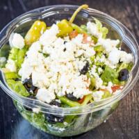 Greek Salad · Cucumbers, lettuce, olives, tomatoes, peppers, pepperoncini, and feta cheese. As with all of...