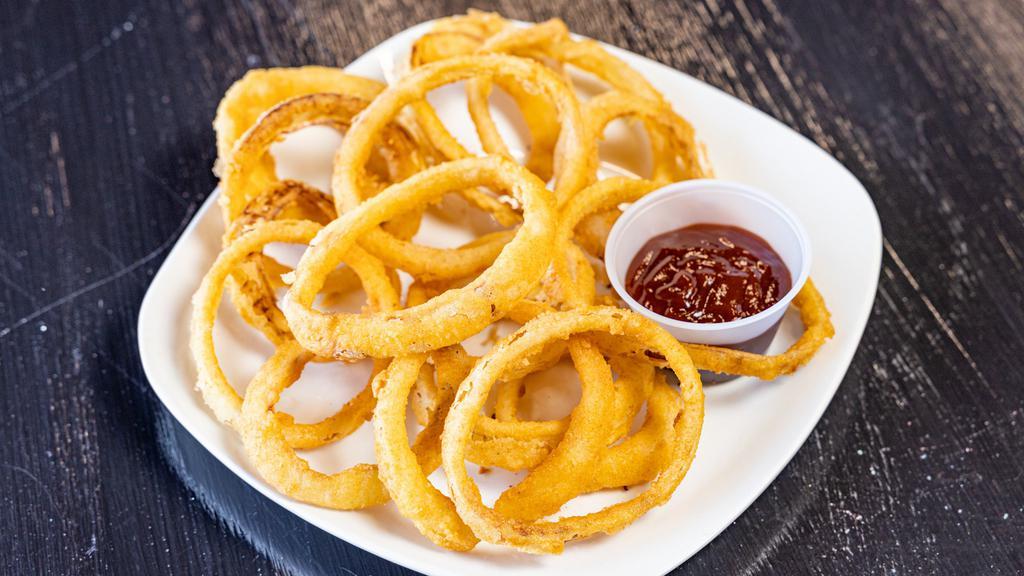 Onion Rings · Crispy onion rings deep-fried until golden-brown, carefully selected product to appeace that craving. Dipped in bbq sauce makes for a great appetizer.