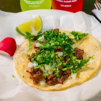 Carne Asada / Beef Tacos · Topped with cilantro and onions. Choice between flour or corn tortilla.