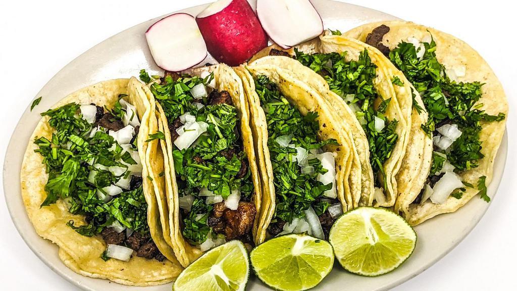 Jalisco / Goat Meat Tacos · Topped with cilantro and onions. Choice between flour or corn tortilla.