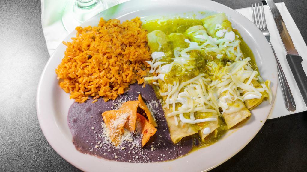Enchiladas · Your choice of meat rolled in corn tortillas topped with our homemade salsa verde, sour cream, and cheese.