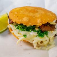 Gordita · Corn dough stuffed with cheese, sour cream, cilantro, onions and your choice of meat.