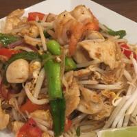 Tom Yum Pad Thai · Spicy stir-fried rice noodles with shrimp and chicken, egg, scallions, lemongrass, mushrooms...