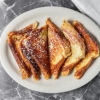 French Toast · Served with butter and syrup.