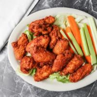 Buffalo Wings (10) · Hot or mild deep fried chicken, wings tossed in spicy buffalo sauce, served with celery and ...