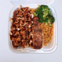 Jerk Chicken & Salmon Fried Rice · Chopped grilled chicken breasts drizzled with house special Jerk-BBQ sauce and a Steak of bl...