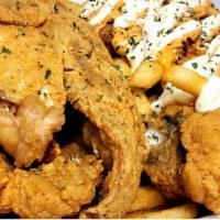 Fried Fish + Cajun Salmon Fries · Fried fish served with a combination of Cajun Salmon Fries