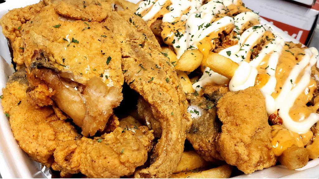 Fried Fish + Cajun Salmon Fries · Fried fish served with a combination of Cajun Salmon Fries