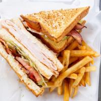 Turkey Club · Served with lettuce, tomatoes and Mayo on wheat or white toast and french fries.