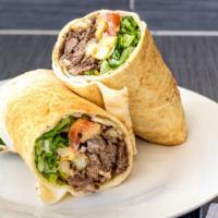 Beef Shawarma · Marinated beef with lettuce, tomatoes, onions, fries, and tahini sauce.