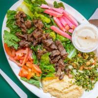 Beef Shawarma Platter · Hummus, tabouli, lettuce, tomato, and tahini sauce.