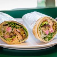 Falafel Roll-Up · Lettuce, tomato, turnip pickles, and tahini sauce. Rolled in a large pita bread with lettuce...