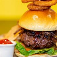 Cowboy Tailgate Burger · Grilled 8oz Burger, Homemade BBQ Sauce, Sliced Smoked Brisket, Topped with Crispy Onion Ring...