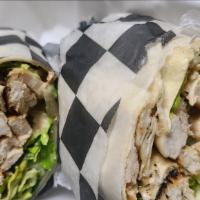 Chicken Caesar Wrap · Marinated grilled chicken, romaine, caesar dressing, provolone, and parmesan cheese.