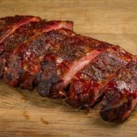 Baby Back Ribs 1/2 Rack · Served dry rubbed or honey bbq glazed