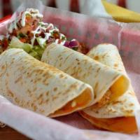 Carnitas Quesadilla (Pork) · Slow cooked pork folded with melted cheese into a flour tortilla.  Served with lettuce, pico...