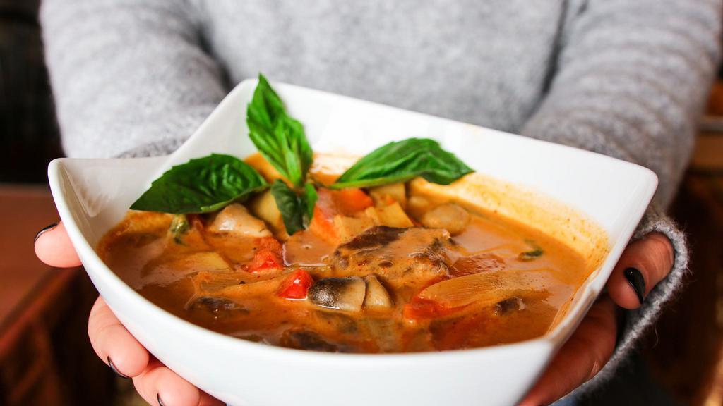 Red Curry · Spicy red curry sauce with coconut milk, bamboo shoots, mushrooms, green peppers and basil with your choice of chicken, beef or pork