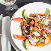 Octopus Salad · Marinated onions, red and green peppers and tomatoes, contains cilantro.