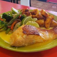 Tropical Salmon
 · Grilled Salmon over a Paul's fresh sauce served with Vegetables and a choice of Rice or Roas...