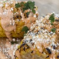Crazy Elote · Grilled Corn with Smoked Spicy Aioli, Queso Fresco and Lime