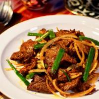 Stir Fried Beef · Stir-fried beef with cumin and pepper.