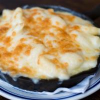 Truffle Mac & Cheese · Sharp white and mild cheddar, and truffle oil.
