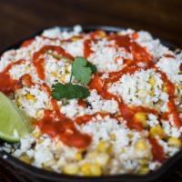 Local Corn 'Elote Locos' · Crema mexicana, charred sweet corn, cotija cheese, red chili and lime.