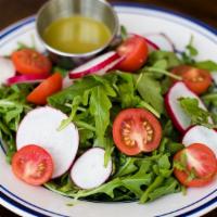 Rocket Salad · Rocket, cherry tomato, sliced-radish, and coriander lime vinaigrette.