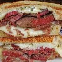 East Side Brisket · Salted brisket, Swiss cheese, garlic aioli, spicy brown mustard, caramelized onions, and pic...