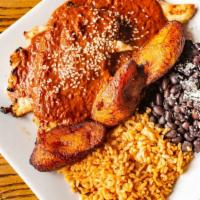 Chicken Mole · Grilled chicken breast served with rice, black beans topped with homemade mole sauce, sesame...