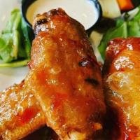 Thai Wings 12 Pieces · Sweet and spicy, topped with sesame seeds