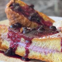 Cheesecake French Toast · Stuffed French Toast with strawberry compote, cream cheese filling, graham cracker crusted, ...