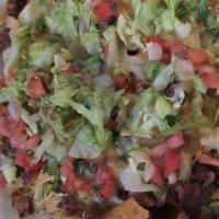 Nachos Carne Asada · Homemade corn chips topped with refried bean, marinated steak, melted cheese, pico de gallo,...
