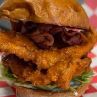Buffalo Clucker  · Fried organic chicken dipped in homemade buffalo sauce, applewood smoked bacon, lettuce, tom...